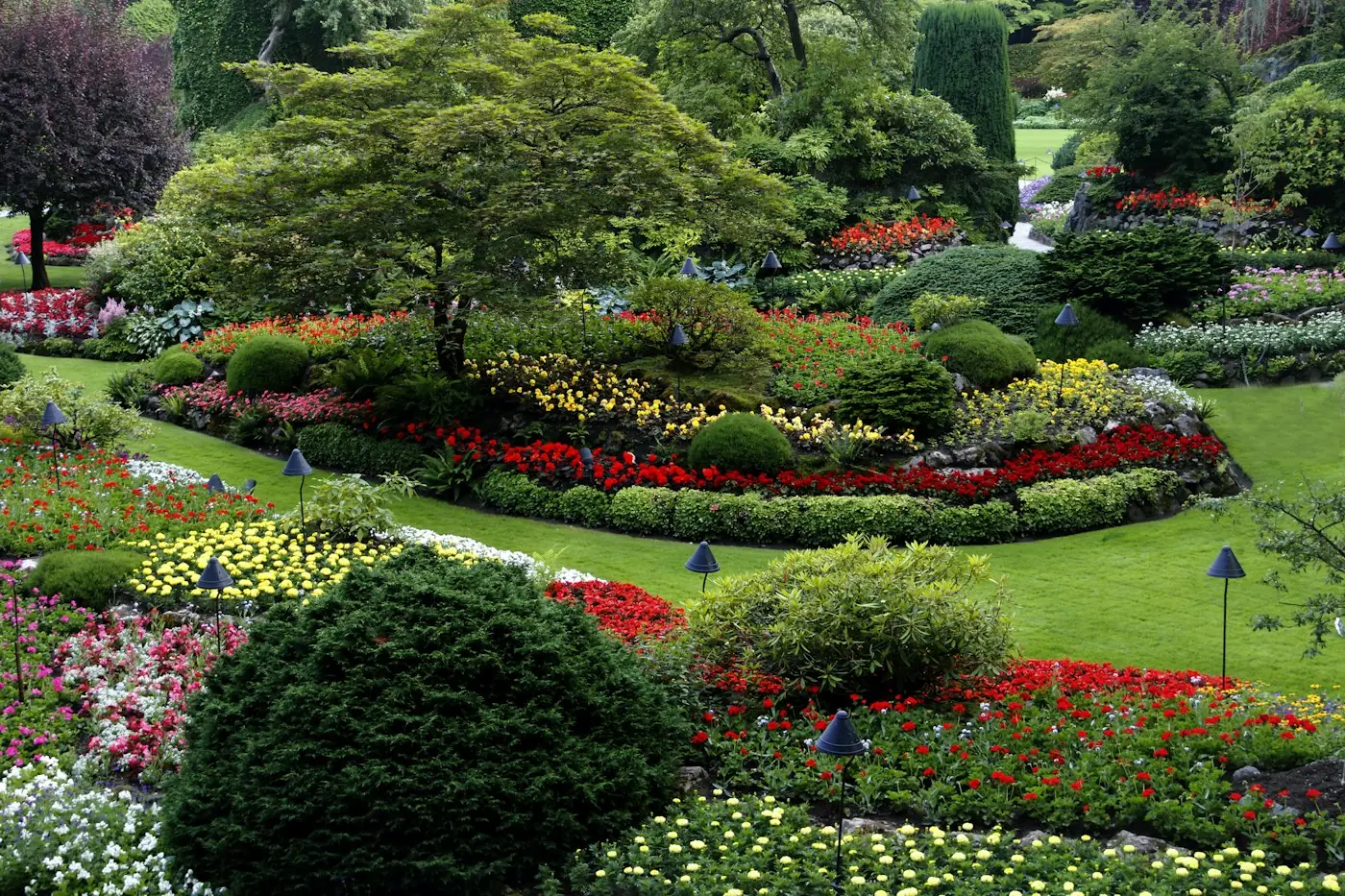 Lush flower beds and manicured shrubs